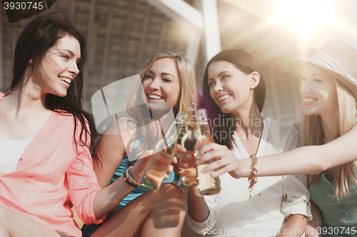 Image of girls with drinks on the beach