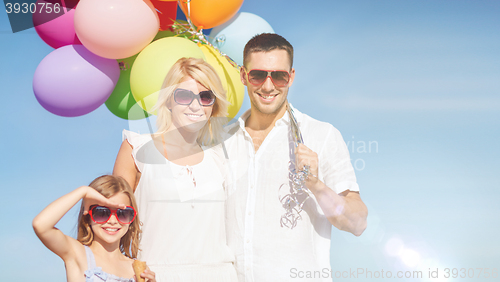 Image of family with colorful balloons