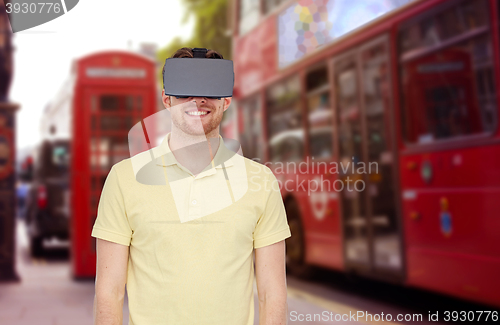 Image of happy man in virtual reality headset or 3d glasses