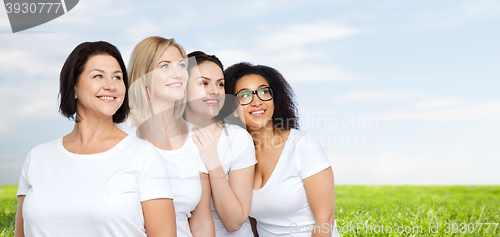 Image of group of happy different women in white t-shirts