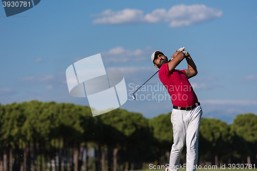 Image of golf player hitting long shot