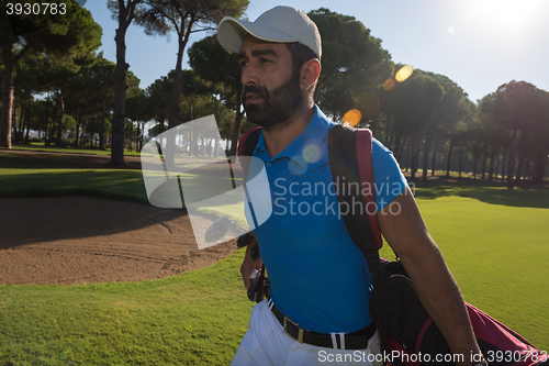 Image of golf player walking