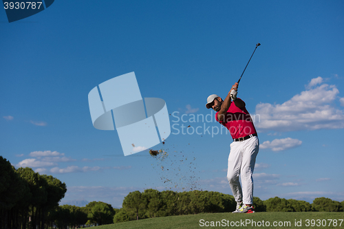 Image of golf player hitting long shot