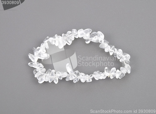 Image of Splintered rock crystal chain on gray background