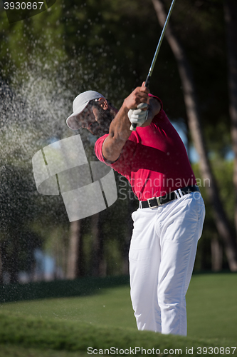 Image of golfer hitting a sand bunker shot