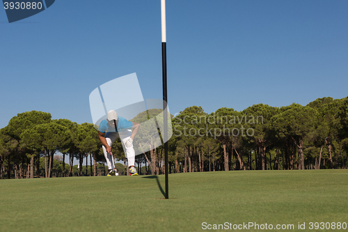 Image of golf player aiming perfect  shot