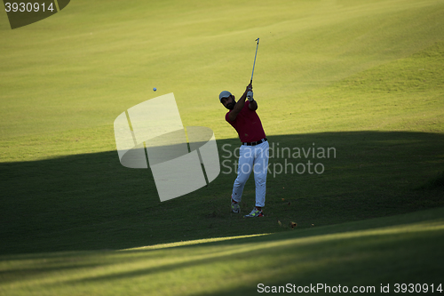 Image of golf player hitting long shot