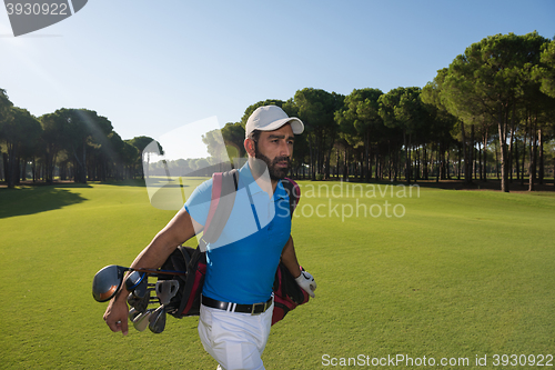 Image of golf player walking