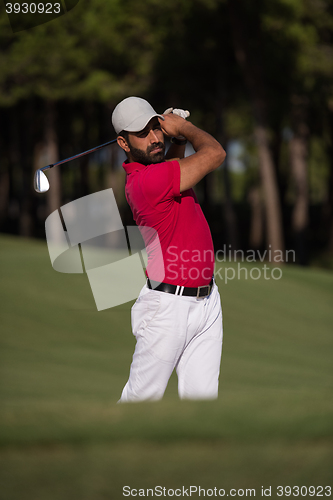 Image of golfer hitting a sand bunker shot