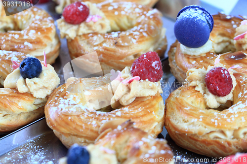 Image of cream puff with raspberries and blueberries