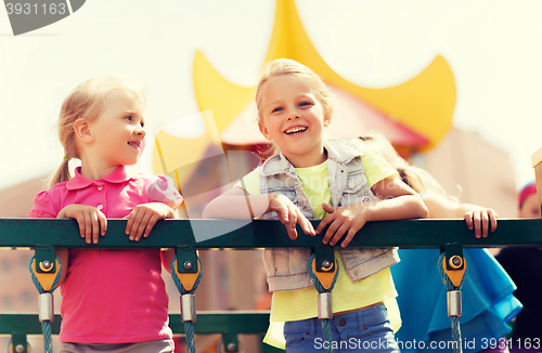 Image of happy little girls on children playground