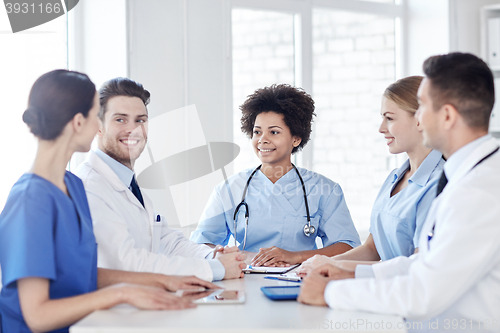 Image of group of happy doctors meeting at hospital office