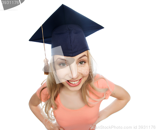 Image of smiling young student woman in mortarboard