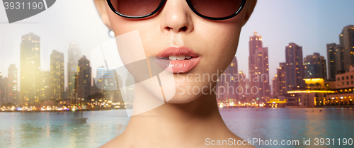 Image of close up of beautiful woman in black sunglasses