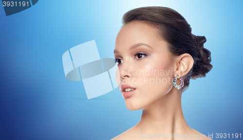 Image of close up of beautiful woman face with earring