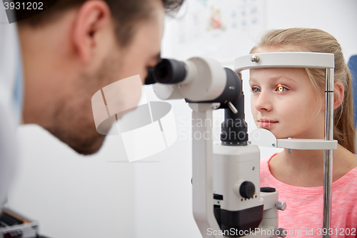 Image of optician with tonometer and patient at eye clinic