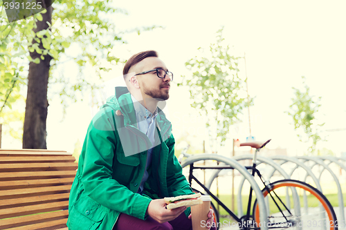 Image of happy young hipster man with fixed gear bike