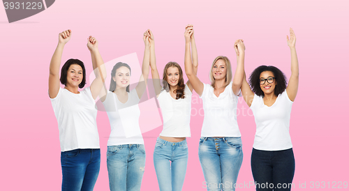 Image of group of happy different women in white t-shirts