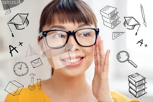 Image of happy asian young woman in glasses at home