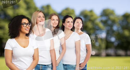 Image of group of happy different women in white t-shirts