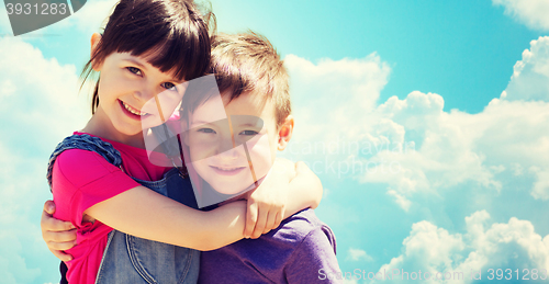 Image of two happy kids hugging over blue sky and clouds