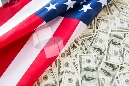 Image of close up of american flag and dollar cash money