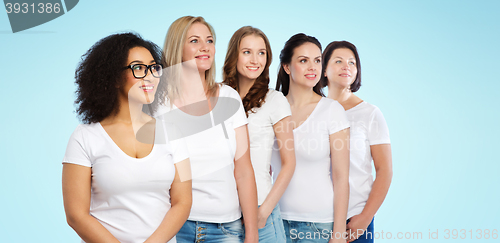 Image of group of happy different women in white t-shirts