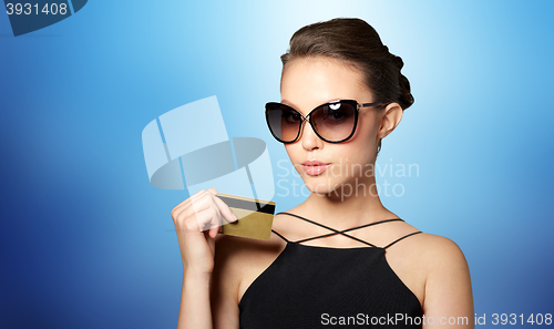 Image of beautiful young woman in elegant black sunglasses