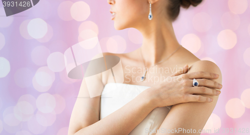 Image of close up of beautiful woman with finger ring