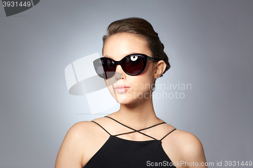 Image of beautiful young woman in elegant black sunglasses