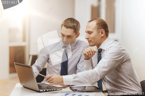 Image of two businessmen having discussion in office