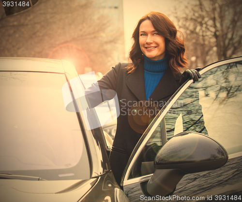 Image of middle-aged woman sits in the car