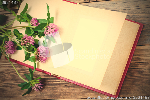 Image of album with open pages and blossom clover. mock up