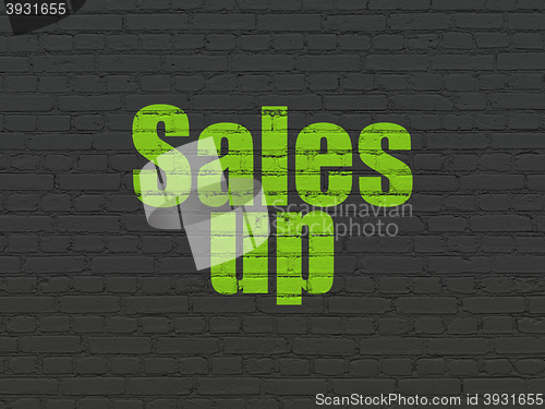 Image of Advertising concept: Sales Up on wall background