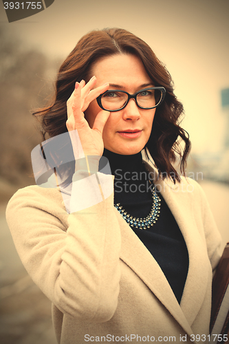 Image of middle-aged woman with glasses