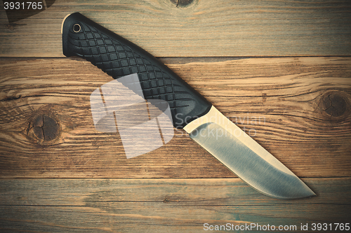 Image of hunting knife with a black handle