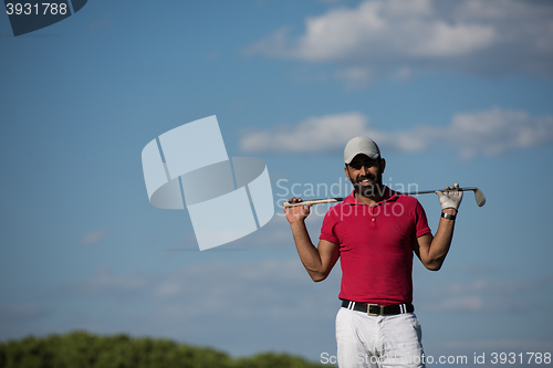 Image of handsome middle eastern golf player portrait at course