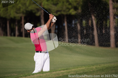 Image of golfer hitting a sand bunker shot