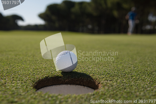 Image of golf ball in the hole