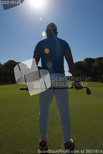 Image of golf player portrait from back