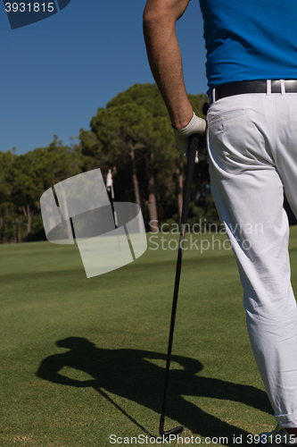Image of golf player portrait from back