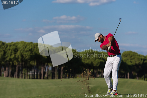 Image of golf player hitting long shot