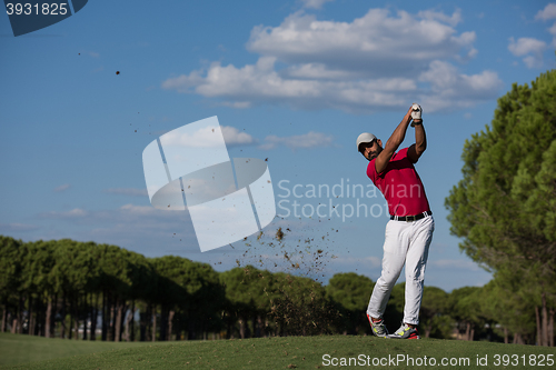 Image of golf player hitting long shot