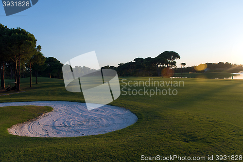 Image of golf course on sunset