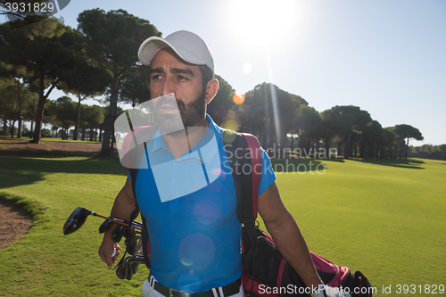 Image of golf player walking