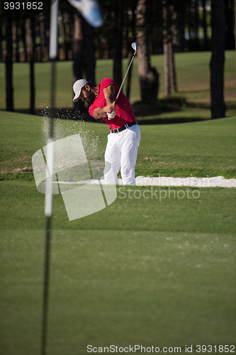 Image of golfer hitting a sand bunker shot