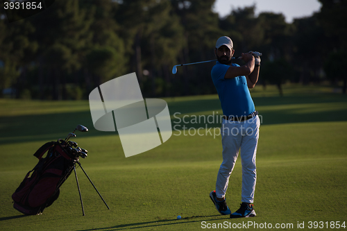 Image of golfer hitting long shot