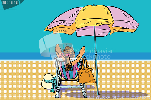 Image of Girl in a deckchair on the beach