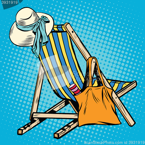 Image of deck chair with beach things women