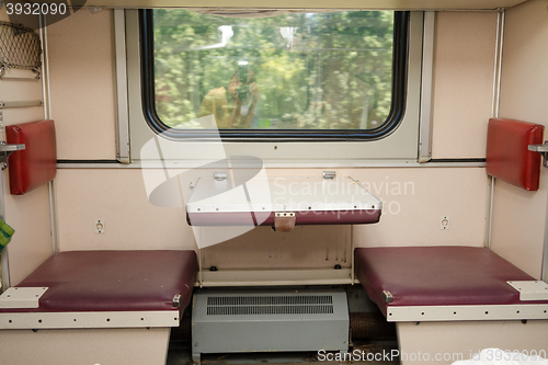 Image of View of the empty seats in the lower second-class compartment wagon train